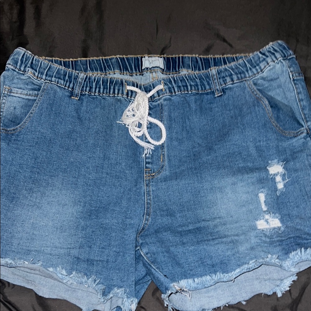 Blue Jean shorts. Brand is Gogo jeans. They have a little bit of stretch to them